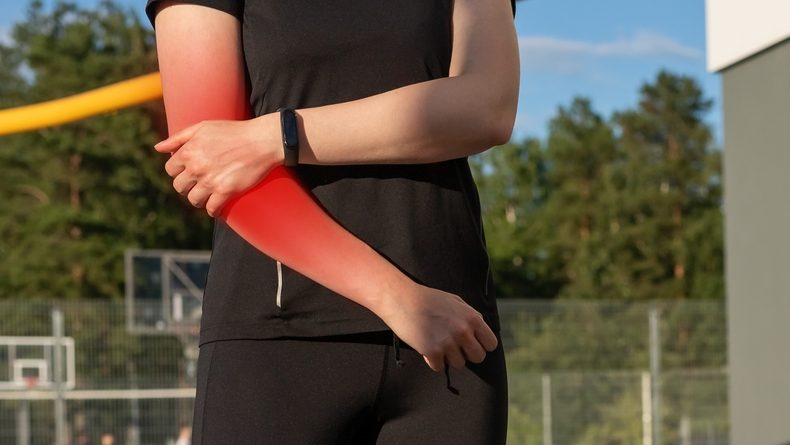 Woman with elbow sport injury
